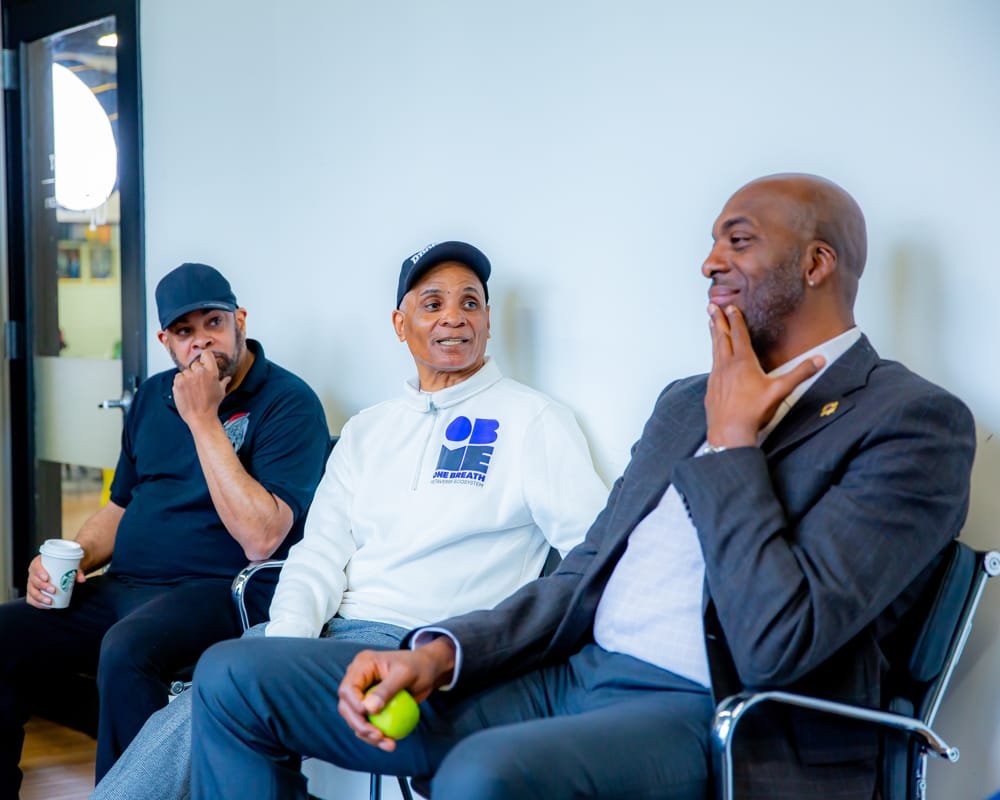 John Salley laughing in the green room before the fireside chat