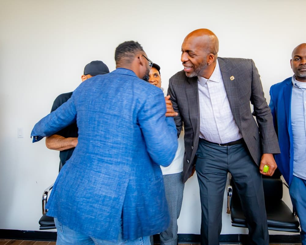 Guests greeting John Salley in the green room