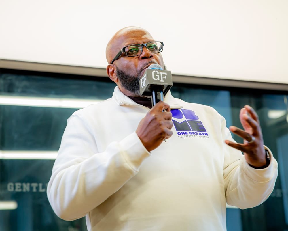 A host speaking to the room before the conversation