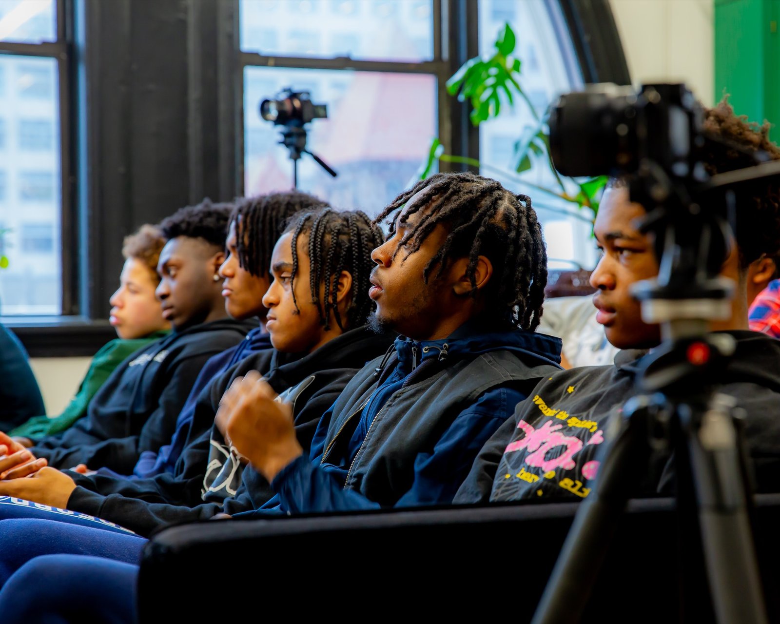 Young men engaged in a Gentlemen's Factory youth program session
