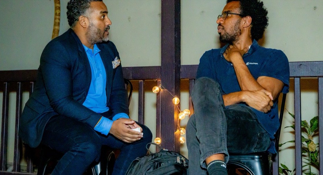 Two men in a one-on-one conversation at a Gentlemen's Factory gathering
