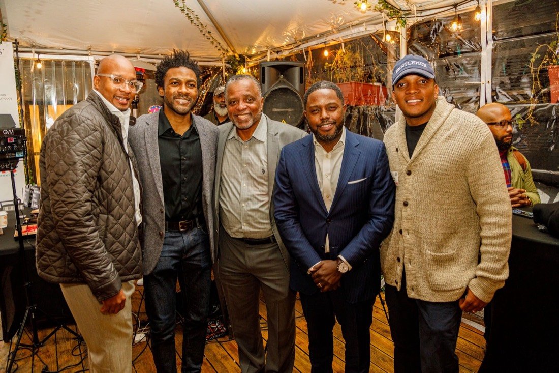 A group of Gentlemen's Factory members together at an evening event